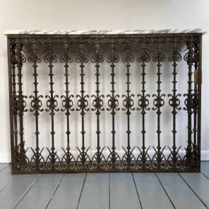A Pair of Wrought Iron Marble Top Consoles